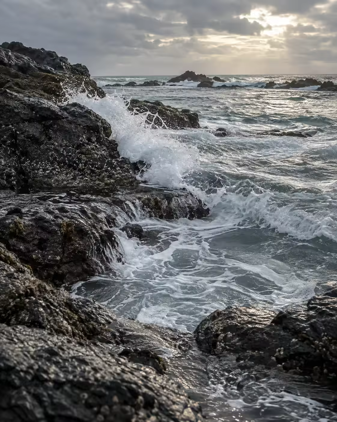Waves folding over dark rock on Sri Lanka's southern coast